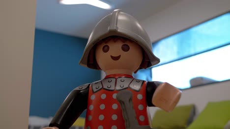 Captivating-close-up-shot-of-toy-character-of-gladiator-wearing-sword,-helmet