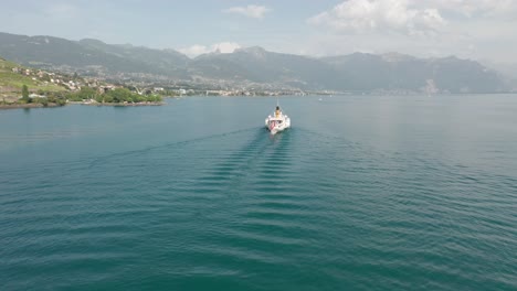 Drone-flying-away-from-classic-cruise-ship-on-Lake-Geneva-on-a-summer-day
