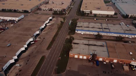 Following-semi-truck-from-the-air-in-the-warehouses-area