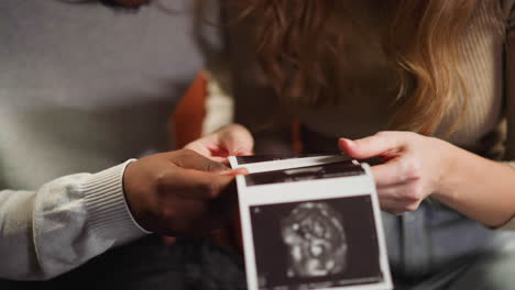 White-woman-and-black-boyfriend-with-ultrasound-pictures