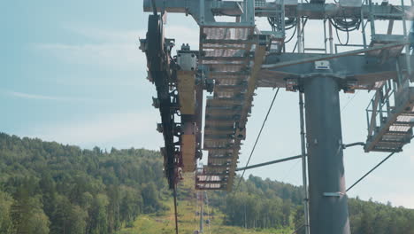 High-aerial-lift-support-with-crossarms-against-mountain
