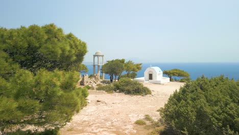 The-Chapel-of-Agios-Mammas,-Kos,-Greece-Overlooking-the-Sea-Reveal-Shot