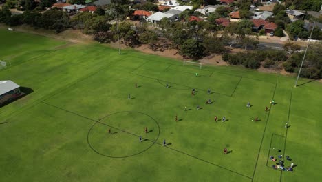 Orbit-Shot-Of-Amateur-Soccer-Football-Match-With-Lateral-Pass,-Perth-City,-Western-Australia