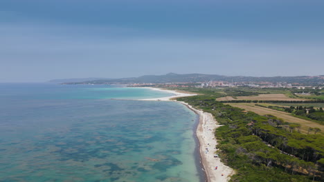 Golden-white-sand-on-tuscan-beach-at-midday-beautiful-ocean-water,-aerial