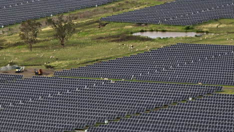 Aerial-Drone-Flyover-Farmland-Surrounded-By-Sustainable-Solar-Power-Farm,-4K-Australia