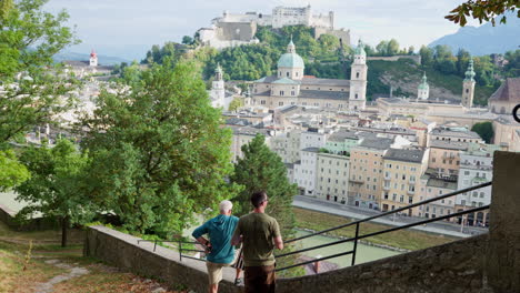 Tourists-enjoying-magnificent-historical-cityscape-of-Salzberg