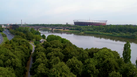 Aerial-View-of-Poniatowski-Bridge-Over-Vistula-River-and-PGE-Narodowy-National-Stadium-in-Praga-district-of-Warsaw-On-Summer-Day