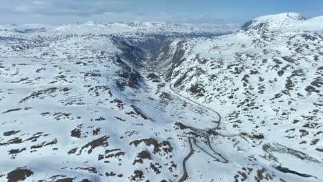 Valley-leading-from-Sognefjellet-mountain-pass-to-Skjolden-and-Luster---Norway-springtime-aerial
