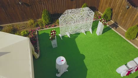 wedding-venue-with-flowers-and-chairs-at-cottage-aerial
