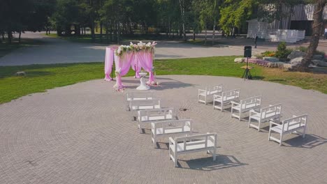 wedding-site-decorated-with-pink-chiffon-in-park-upper-view