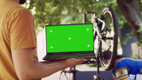 Bike-repair-with-greenscreen-on-laptop