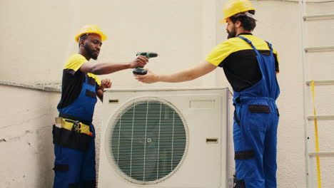 Engineers-opening-rusty-air-conditioner