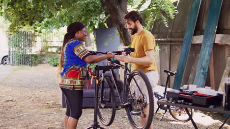 Bicycle-adjustment-by-multiethnic-couple