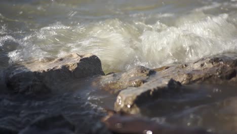 This-is-waves-crashing-on-rocks-at-a-lake-or-ocean