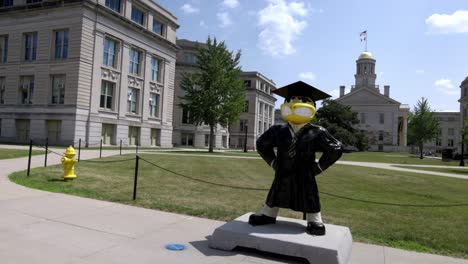 Hawkeye-statue-on-the-campus-of-the-University-of-Iowa-in-Iowa-City,-Iowa-with-gimbal-video-panning-left-to-right-close-up