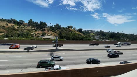 Trucking-right-view-of-the-Interstate-405-from-the-moving-train-at-The-Getty-Center-in-Los-Angeles-California