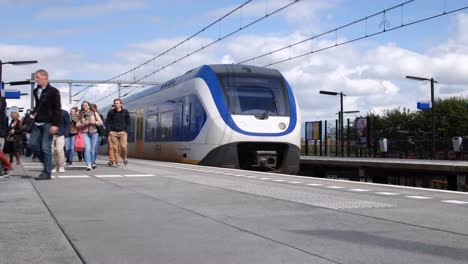Passengers-on-daily-commutes-use-the-trains-at-Sassenheim,-Netherlands