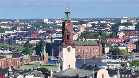 Beautiful-aerial-of-Stockholm-City-Hall-and-Storkyrkan-church-over-old-town
