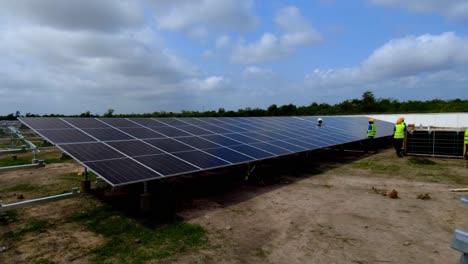 Time-lapse-view-of-all-youth-female-African-Gambian-technicians-engineers-installing-bifacial-solar-panels-in-Jambur,-The-Gambia---NAWEC-TBEA-solar-photovoltaic-power-plant