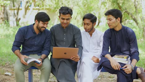 College-scene-of-Indian-teenagers-sitting-together-and-smiling,-looking-at-the-camera