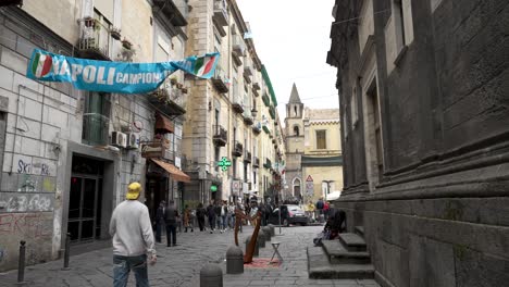 Street-In-Naples-With-Napoli-Football-Banner-Strawn-Across-Between-Buildings