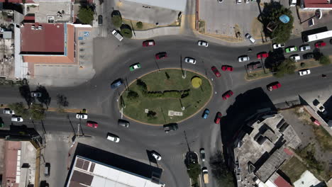 Overhead-View-of-Traffic-In-The-Roundabout-With-Asphalt-Road-In-Guanajuato,-Mexico