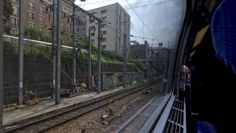 POV-Looking-Out-Of-TGV-inOui-Window-Leaving-Paris-Suburbs
