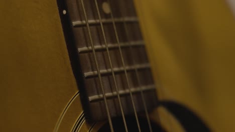 An-old-acoustic-guitar-shot-in-slow-motion