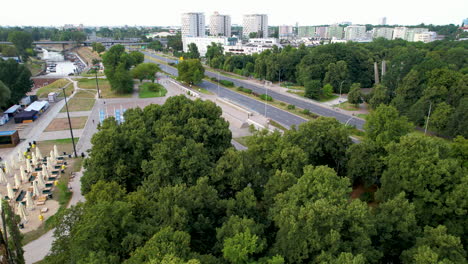 Daytime-Traffic-on-Wioslarska-Highway-in-Warsaw-by-Vistula-River-bank---Aerial-View-in-Summer
