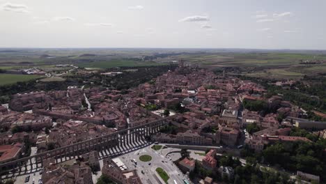 Aerial-view-circling-Segovia-city-aqueduct-and-La-Latina-neighbourhood,-North-West-Madrid,-Spain-city-landscape