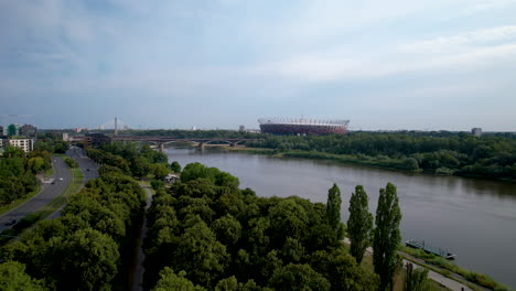Aerial-View-of-Poniatowski-Bridge-Over-Vistula-River-and-PGE-Narodowy-National-Stadium-in-Praga-District-of-Warsaw---Push-in