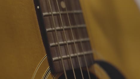 Close-up-look-at-strings-vibrating-on-a-guitar