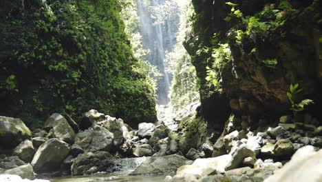 Static-shot-of-a-hidden-waterfall-that-leads-to-a-river-in-Hawaii