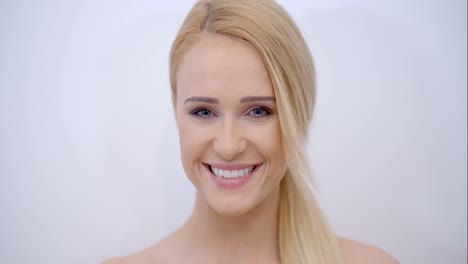 Smiling-Face-of-Blond-Woman-Looking-at-Camera