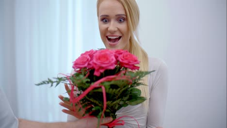 Happy-young-woman-with-a-bouquet-of-flowers