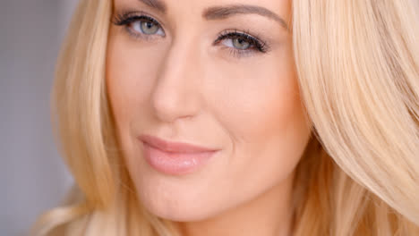 Close-up-Pretty-Blond-Woman-Face-with-Gray-Eyes