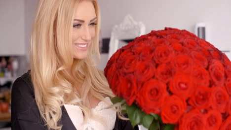 Happy-Woman-with-Fresh-Red-Rose-Flower-Bouquet