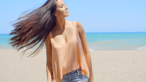 Woman-at-the-Beach-with-Hair-Flying-in-the-Wind