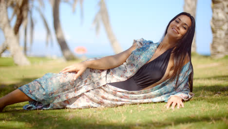 Lady-in-Beach-Dress-Relaxing-at-Grassy-Ground