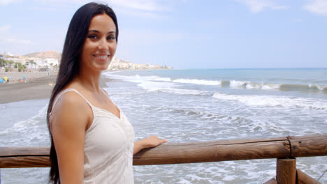 Pretty-Lady-at-the-Beach-Railing-Smiling-at-Camera