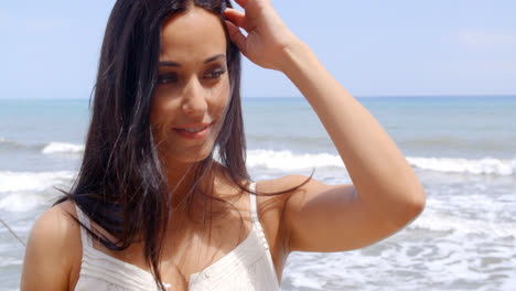 Pretty-Young-Woman-at-the-Beach-Smiling-at-Camera