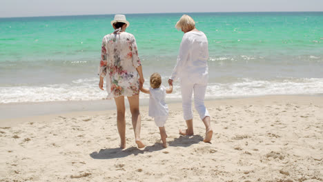 Grandmother--mother-and-baby-girl-at-the-seaside