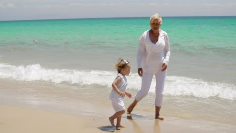 Little-Girl-and-Grandmother-Playing-at-the-Beach