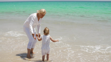 Grandmother-and-Little-Girl-Enjoying-at-the-Beach