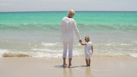Grandmother-and-granddaughter-at-the-seaside