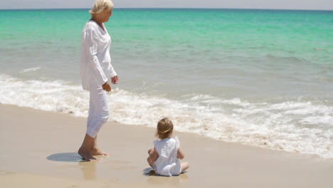 Grandma-Watching-Over-her-Little-Girl-at-the-Beach