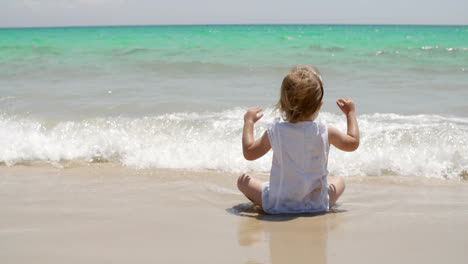 Cute-little-girl-enjoying-the-sea