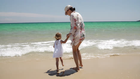 Mother-and-Daughter-Enjoying-the-Beach-on-Summer