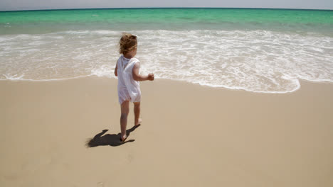 Small-girl-enjoying-herself-at-the-seaside