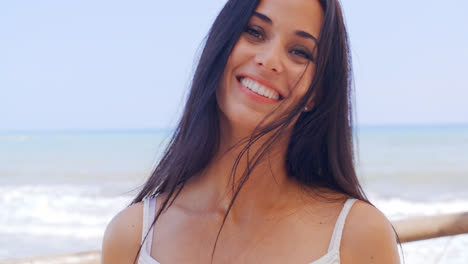 Happy-Young-Woman-at-the-Beach-with-a-Toothy-Smile